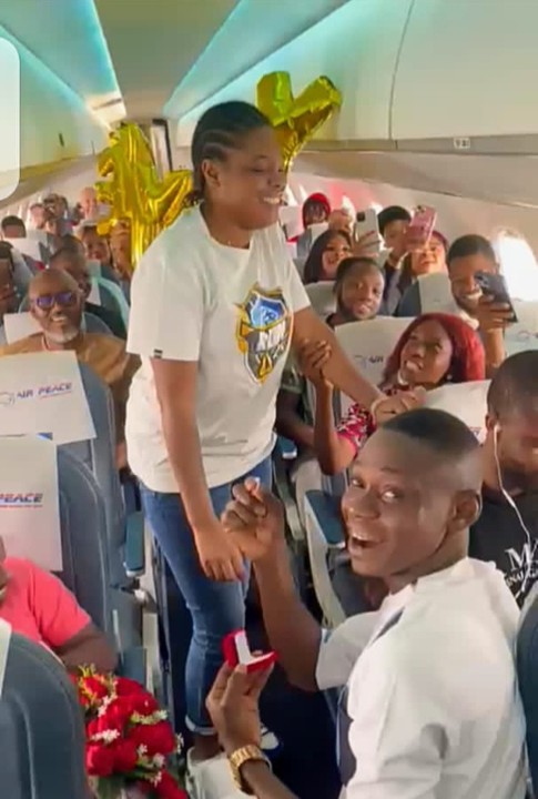 Photos As Nigerian Man Proposes To Girlfriend Mid-air On Air Peace Flight