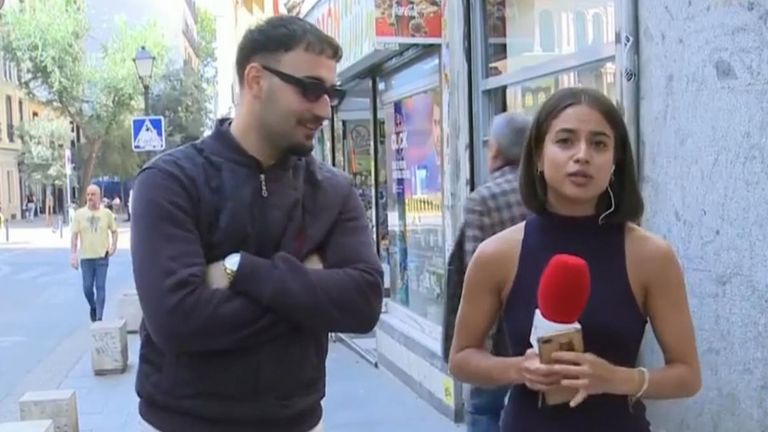 Police arrest man for touching a female reporter's bum on live TV